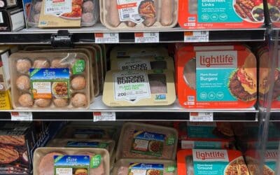 Meat alternative products on supermarket shelves.