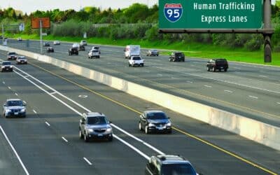 A highway sign reads i95 human trafficking express lanes.