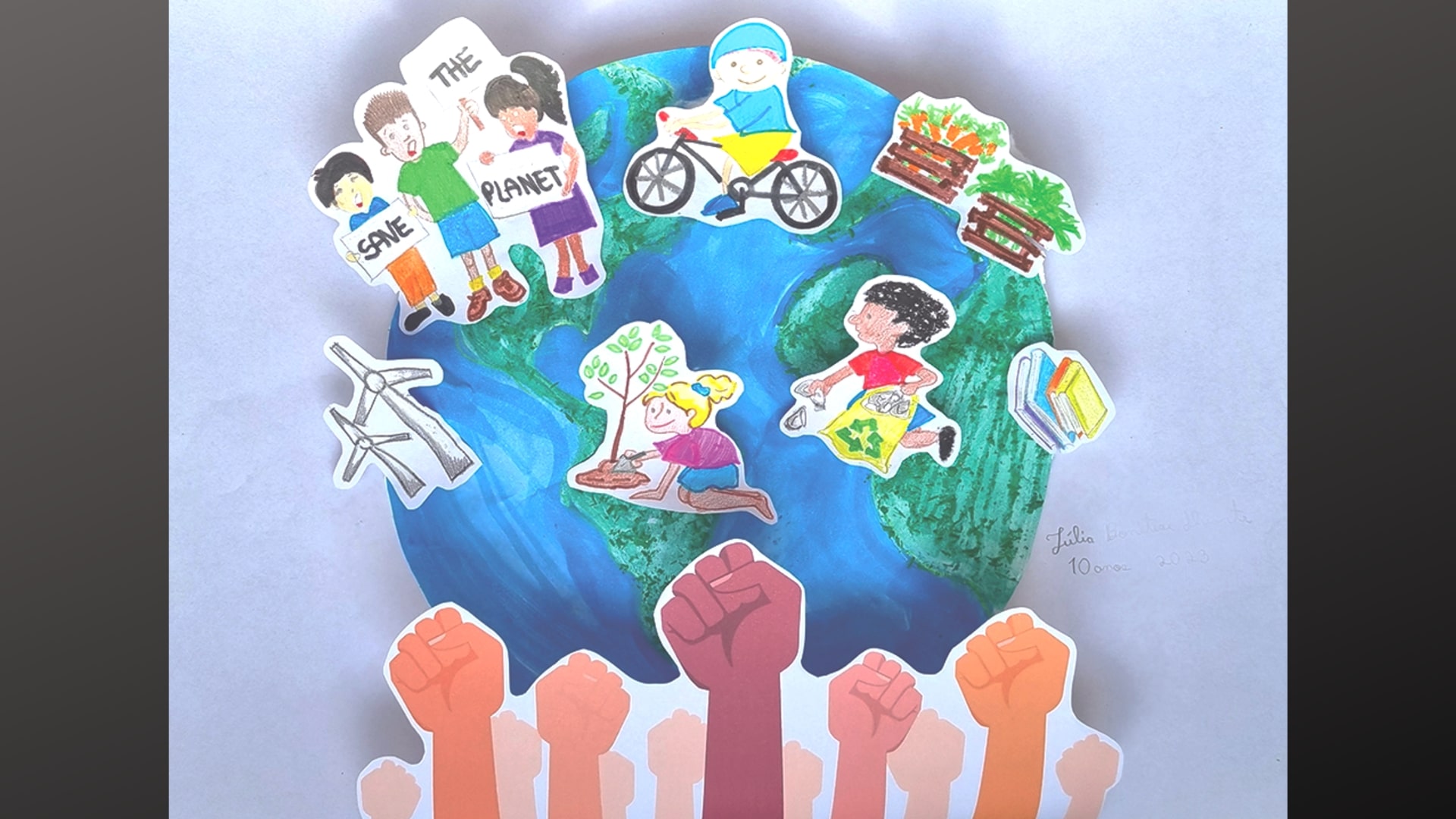 An entry in the children's climate art contest shows the earth and raisedd fists. 