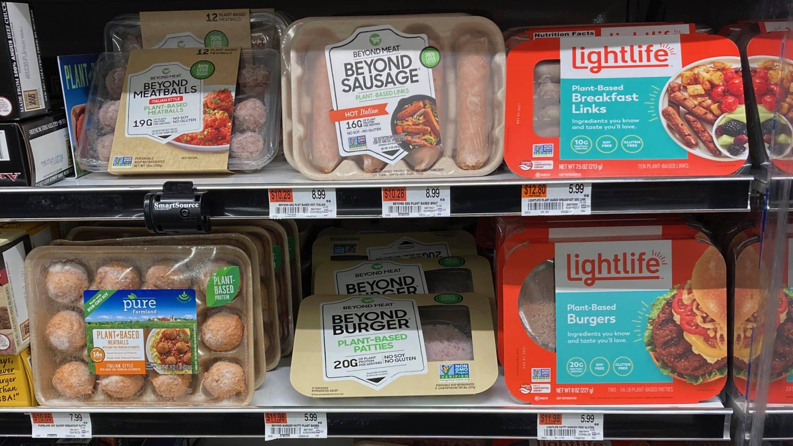 A variety of meat alternatives on supermarket shelves.