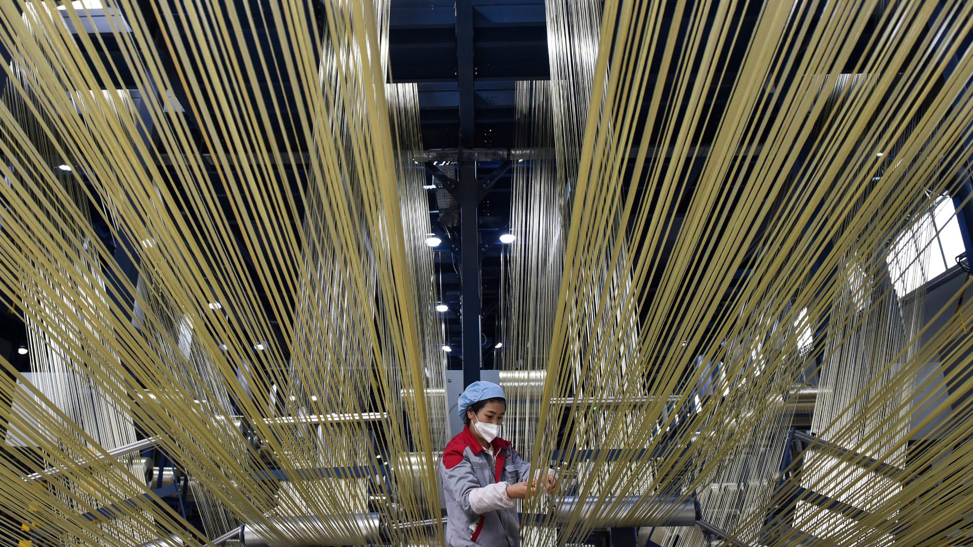 A woman in a fiber technology facctory in China. 