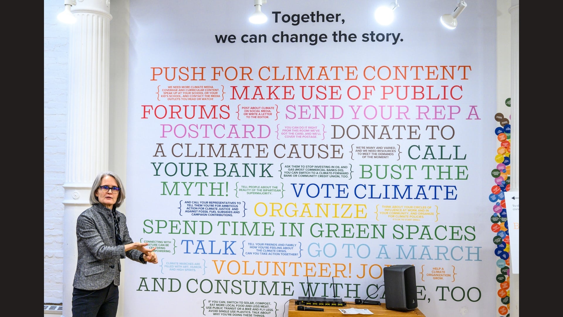 Climate Museum director Miranda Massie speaks in front of their "Climate Action Wall" in their pop-up site in Soho, New York city.