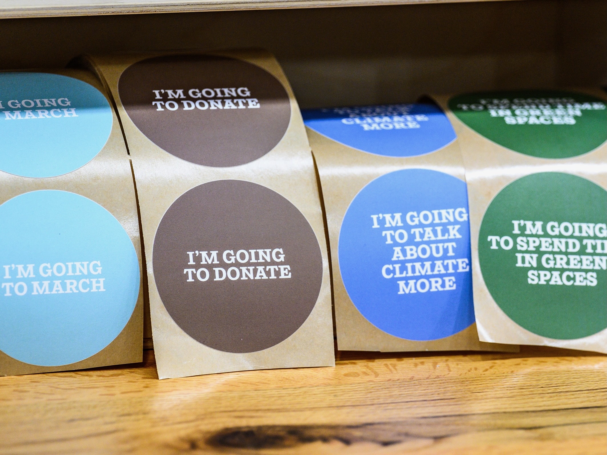 Stickers with call-to-action phrases are avaialbe to be plastered by visitors into the "Climate Action Wall" at the Climate Museum in Soho, New York city.<br />
