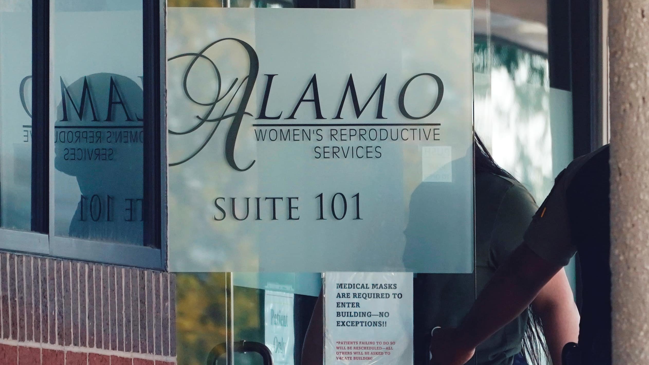 A woman enters Alamo Women's Reproductive Services in October 2021 in San Antonio.