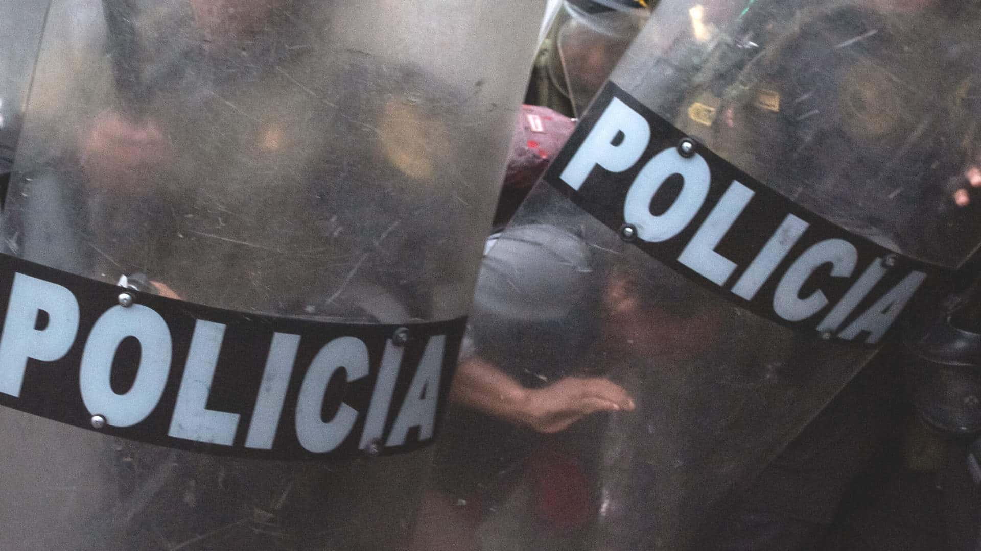 A man beaten by police during the protests against the government of Dina Boluarte in Lima 