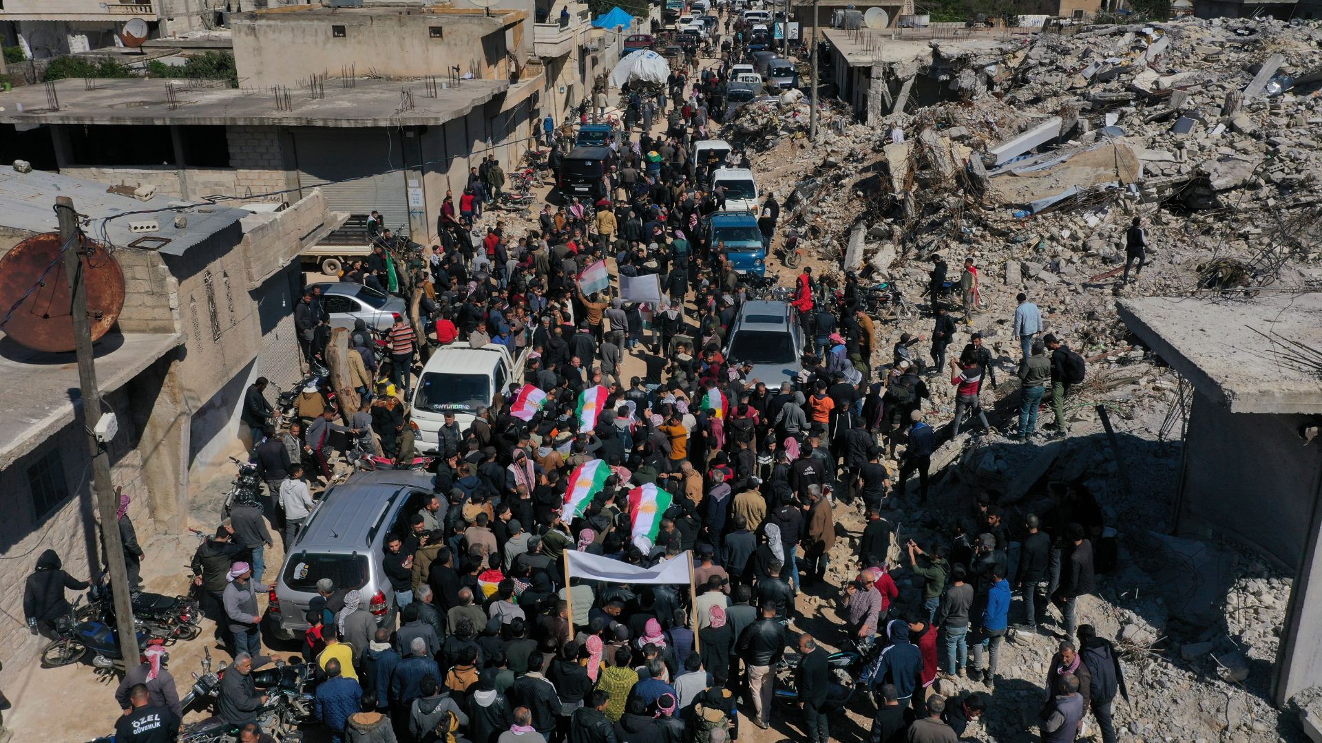 People attend funeral of four four Kurds in the town of Jinderis, Syria