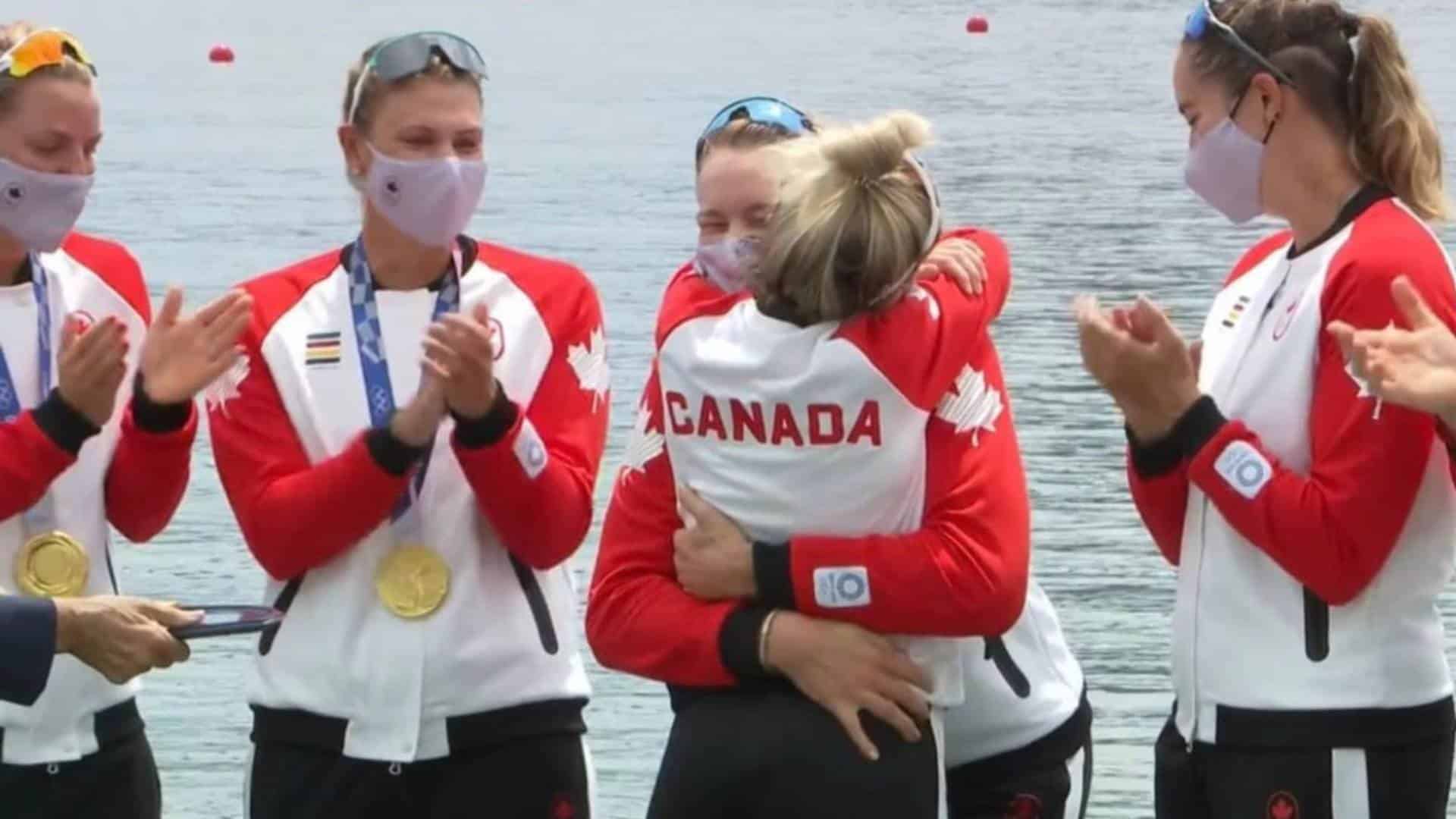 Canadian Olympic rower Christine Roper (frontside) hugging her teammate as they celebrate their gold medal victory. 