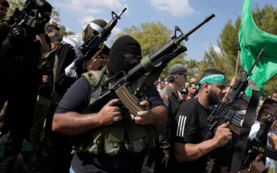 Palestinian militants attend a funeral of people killed during an Israeli military raid on a Palestinian refugee camp, Nur Shams, in the West Bank