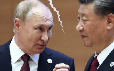 Russian President Vladimir Putin speaks to Chinese President Xi Jinping during a summit in Uzbekistan